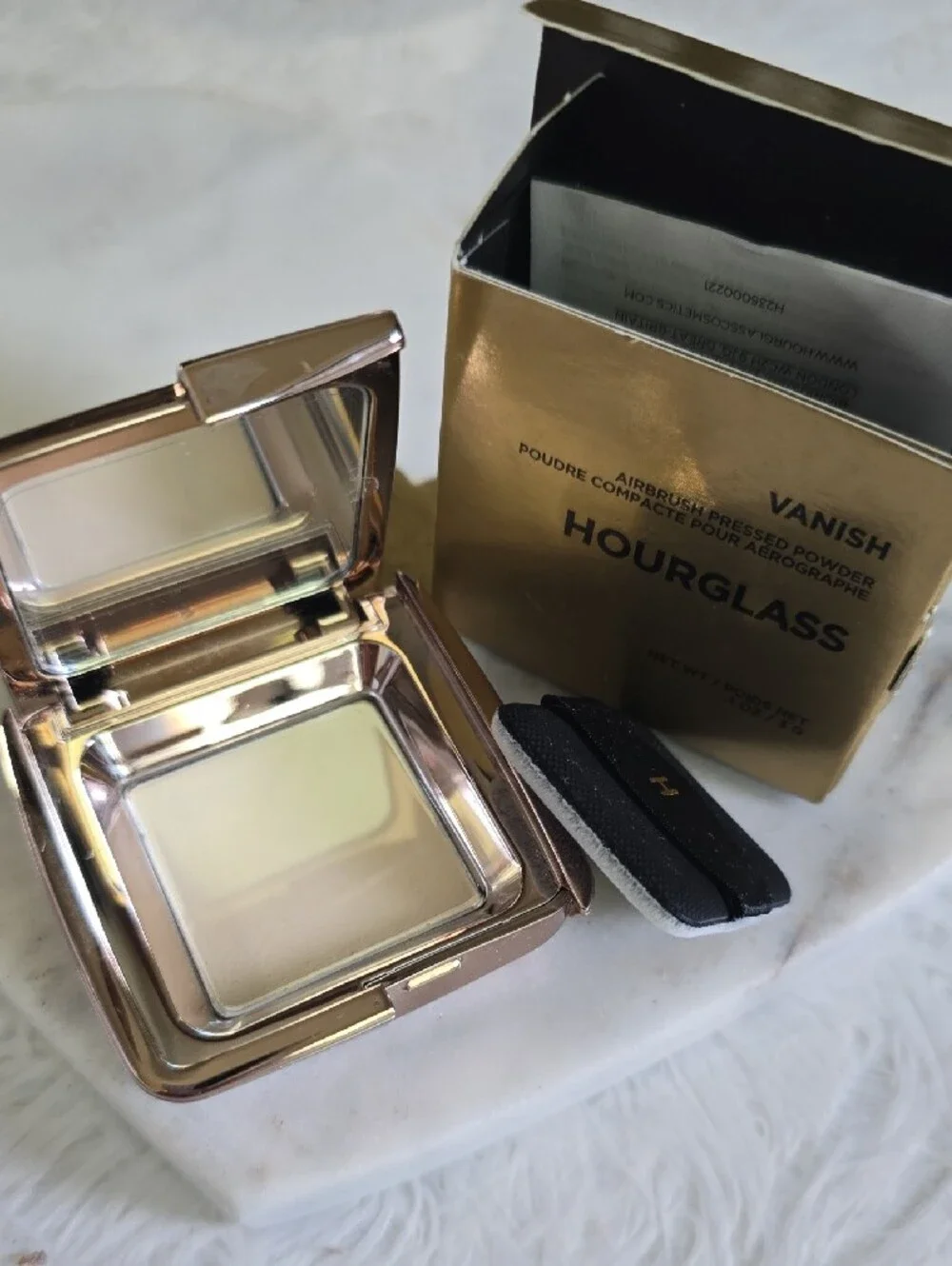 Hourglass compact pressed